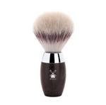 Shaving brush with wooden handle and silver ferrule on a white background